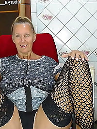 Slender older granny is masturbating