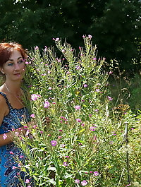 In blue dress in field