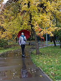 Aroused aged businesswoman is spreading her legs